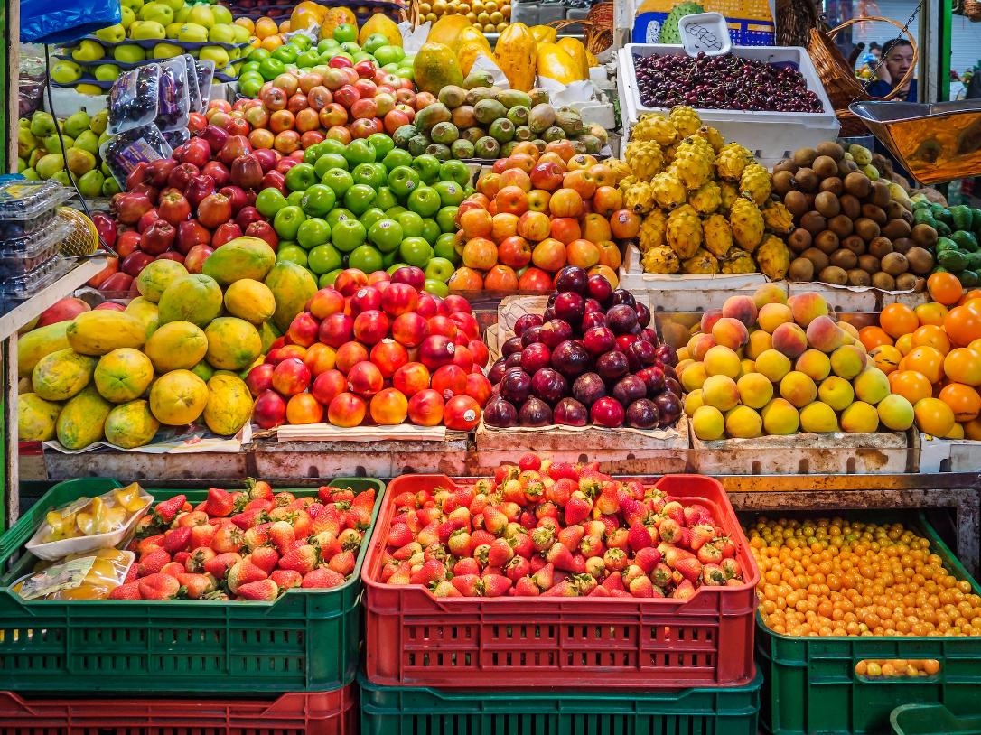 red and green apples on red plastic crate